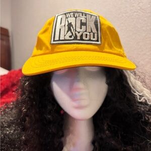 Bold Yellow Hat with 'We Will Rock You' Patch